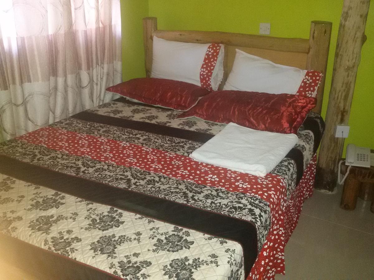 Unik Hotel Kireka Habitación foto